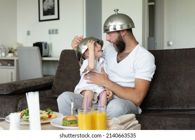 Father And Son Have Breakfast In A Hotel Room And Indulge, Laugh.