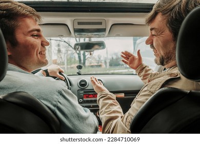 father and son have a discussion inside the car - Powered by Shutterstock