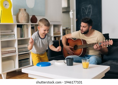 father and son having fun at home - Shutterstock ID 1946177101