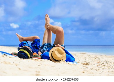 Father And Son Having Fun On The Beach