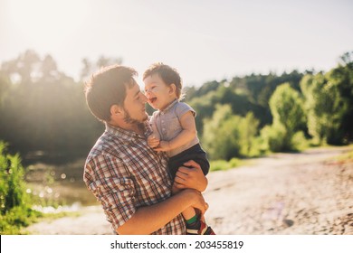 Father And Son Having Fun Outdoors