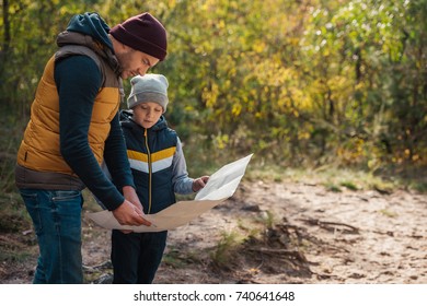 father and son holding map while hiking together in autumn forest
the map was printed from http:maps.nypl.orgwarper - Powered by Shutterstock