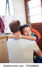 Father And Son Hug Goodbye Before School Love And Affectionate Embrace