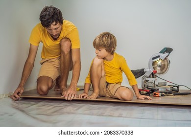 Father and son installing new wooden laminate flooring on a warm film floor. Infrared floor heating system under laminate floor - Shutterstock ID 2083370338