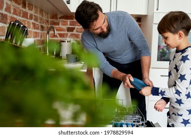 Father and son loading dishwasher - Powered by Shutterstock