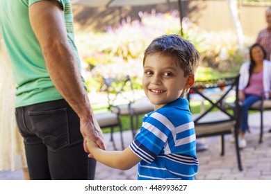 Father with son looking over shoulder