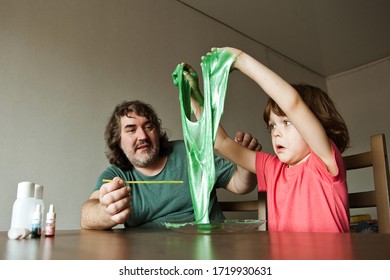 Father and son make slime at home. Homemade experiments. - Powered by Shutterstock