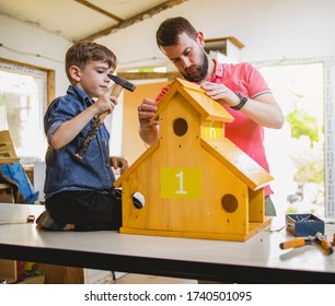 Father And Son Making A Birdhouse