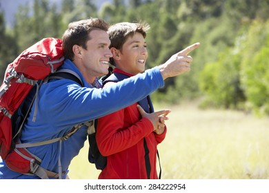 Father And Son On Hike In Beautiful Countryside - Shutterstock ID 284222954