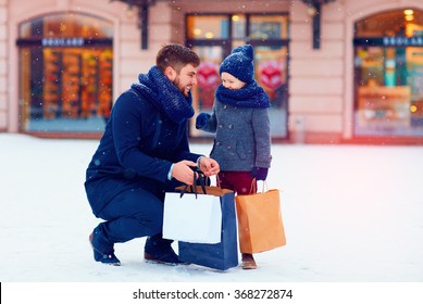 Father And Son On Winter Shopping In City, Holiday Season, Buying Presents