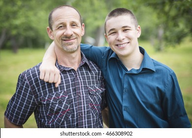 Father with son outside in a forest