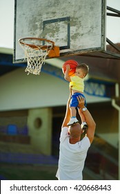 Father And Son Playing Basketball