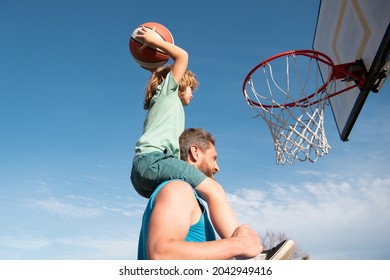 Father And Son Playing Basketball. Dad And Child Spending Time Together.