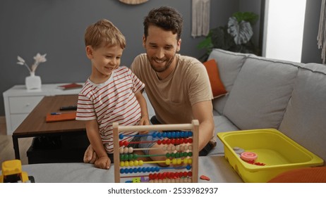 Father and son playing with colorful abacus toy on couch in home living room - Powered by Shutterstock