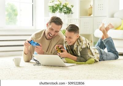 Father And Son Playing Computer Game