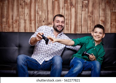 Father And Son Playing In The Console, A Family Vacation, The Concept Of Family Values And The Modern-day Game