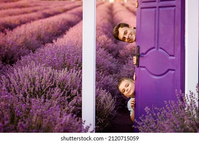 Father And Son Are Playing In The Lavender Field And Open A Door.