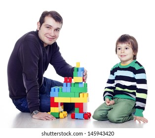 Father And Son Playing Lego