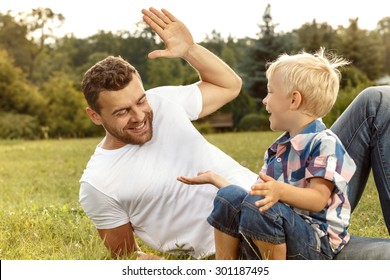 Father and son playing on the field