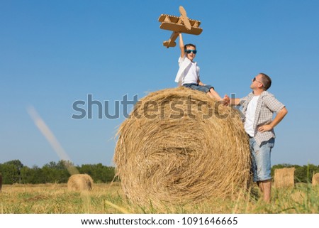 Similar – Vater und Sohn spielen im Park