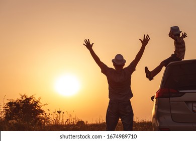 Father and son playing in the park at the sunset time. People having fun on the field. Concept of friendly family and of summer vacation. - Shutterstock ID 1674989710