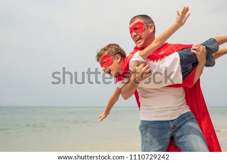 Image, Stock Photo Father and son playing superhero on the beach at the day time. People having fun outdoors. Concept of summer vacation and friendly family.