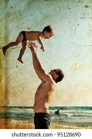 Father And Son Playing Together On The Beach. Photo In Old Image Style.