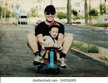 Father And Son Playing Together. Photo In Old Image Style