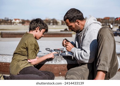 Father and son repairing drone - Powered by Shutterstock