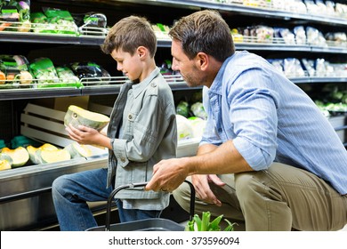 Father and son shopping in the grocery store - Powered by Shutterstock