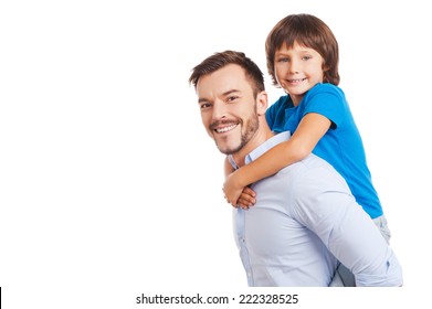 Father And Son. Side View Of Happy Father Carrying His Son On Back And Smiling While Both Standing Isolated On White