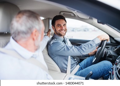 Father and son sitting in car, driving and talking. - Powered by Shutterstock