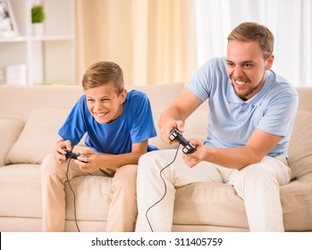 Father and son spend time together, are playing game. - Shutterstock ID 311405759