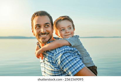 A Father with is son at the sunset - Powered by Shutterstock