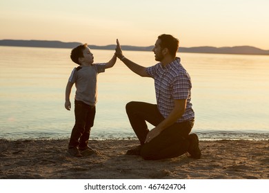 Father with is son at the sunset - Powered by Shutterstock