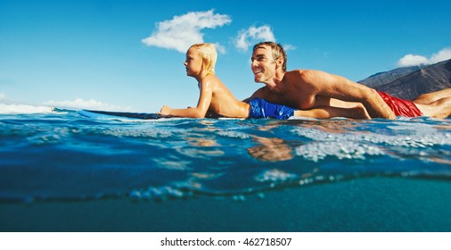 Father and son surfing together, summer lifestyle fun