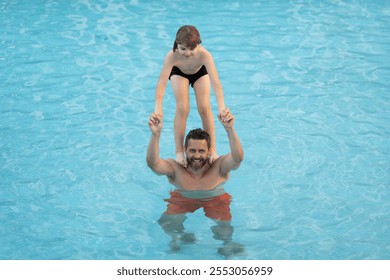 Father and son swimming in pool, summer family weekeng. Father and son on summer family holiday. Father and son relaxing in pool water. Family in swimming pool. Child with dad swimming in pool. - Powered by Shutterstock