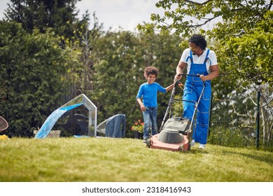 Father and son as they work together to mow the lawn.Side by side,their determined expressions and synchronized movements showcase their teamwork and shared commitment to maintaining a well-kept yard. - Powered by Shutterstock