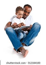 Father And Son Using Tablet Computer. Learning And Early Education Concept / Photos Of Hispanic Man And Mixed Race Boy Over White Background