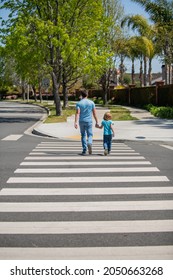 Father And Son Walk On Zebra Crossing. Family Value. Parent Leading Small Child Boy