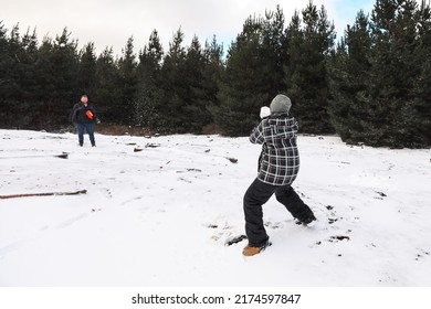 Father And Son Winter Snow Ball Fight