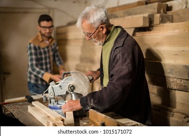 Father And Son Working In Carpenter Shop