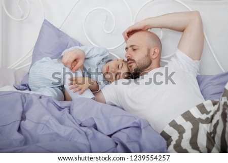 Similar – Baby asleep while parents caress