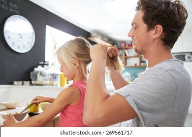 Father Styling Daughter's Hair At Breakfast Table - Powered by Shutterstock