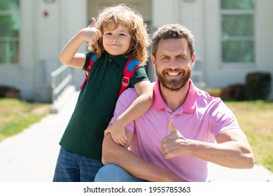 Father supports and motivates son. Kid with thumbs up going to primary school. Back to school