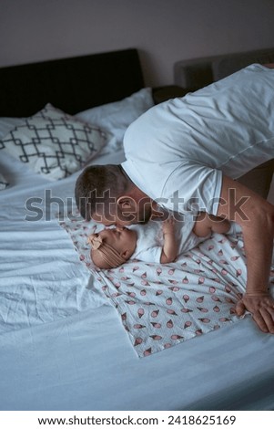 Similar – Image, Stock Photo Man reading with wife and son sleeping