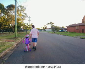 Father Taking His Child For Bycicle Ride