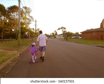 Father Taking His Child For Bycicle Ride