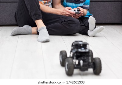 The Father Teaches His Son How To Ride The Radio Control Car