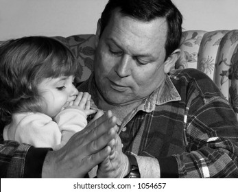 Father Teaching His Little Girl To Pray